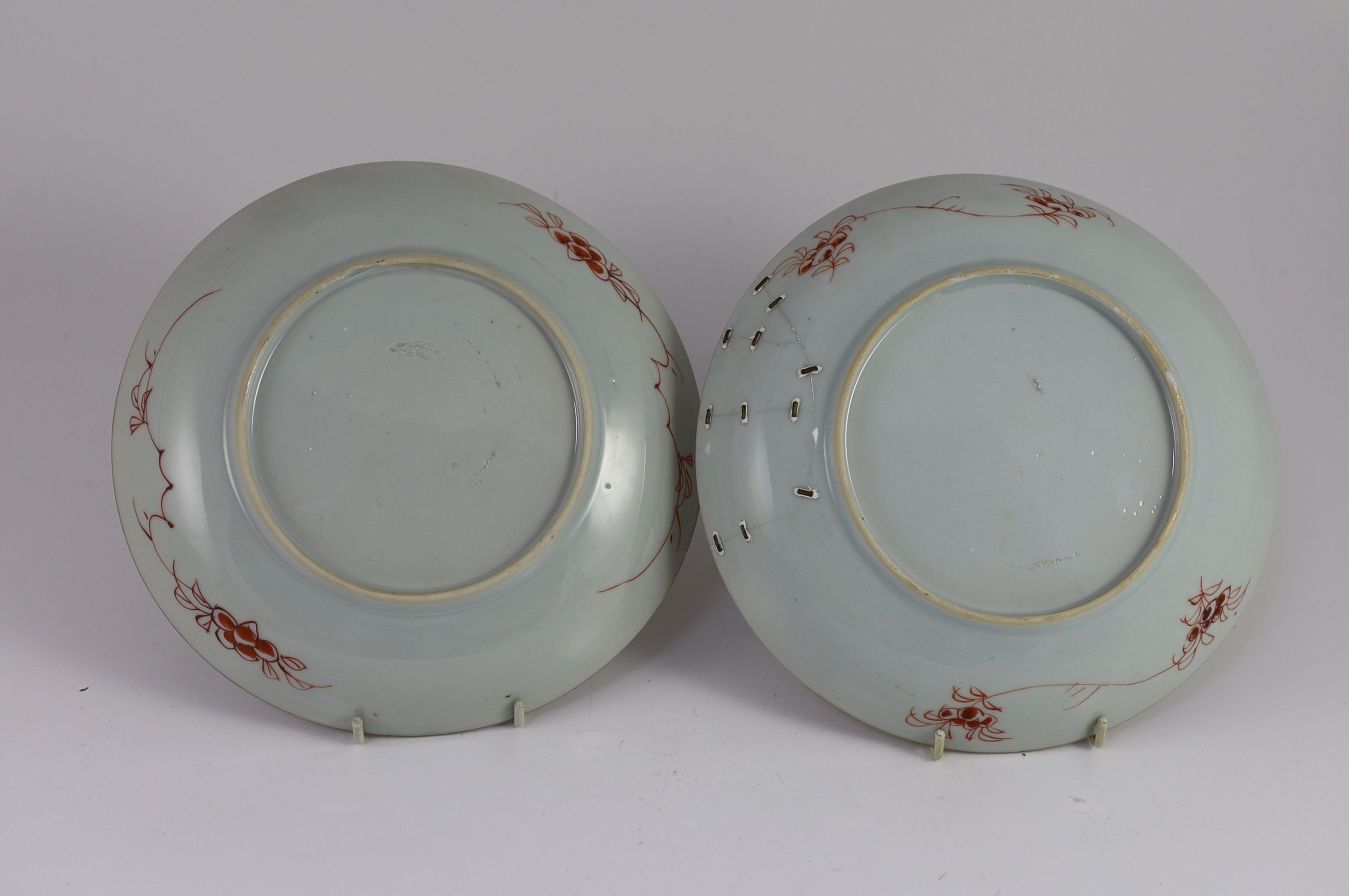 A pair of Chinese famille rose dishes, early Qianlong period, 22 cm diameter, one broken and repaired